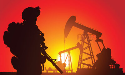 bigstock US soldier with oil rigs on th 30797705