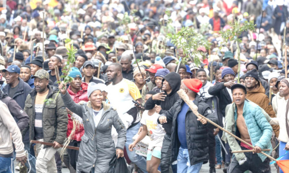 Protesters walk in street during a protest march against undocumented migrants in Yeoville Johannesburg South Africa recently