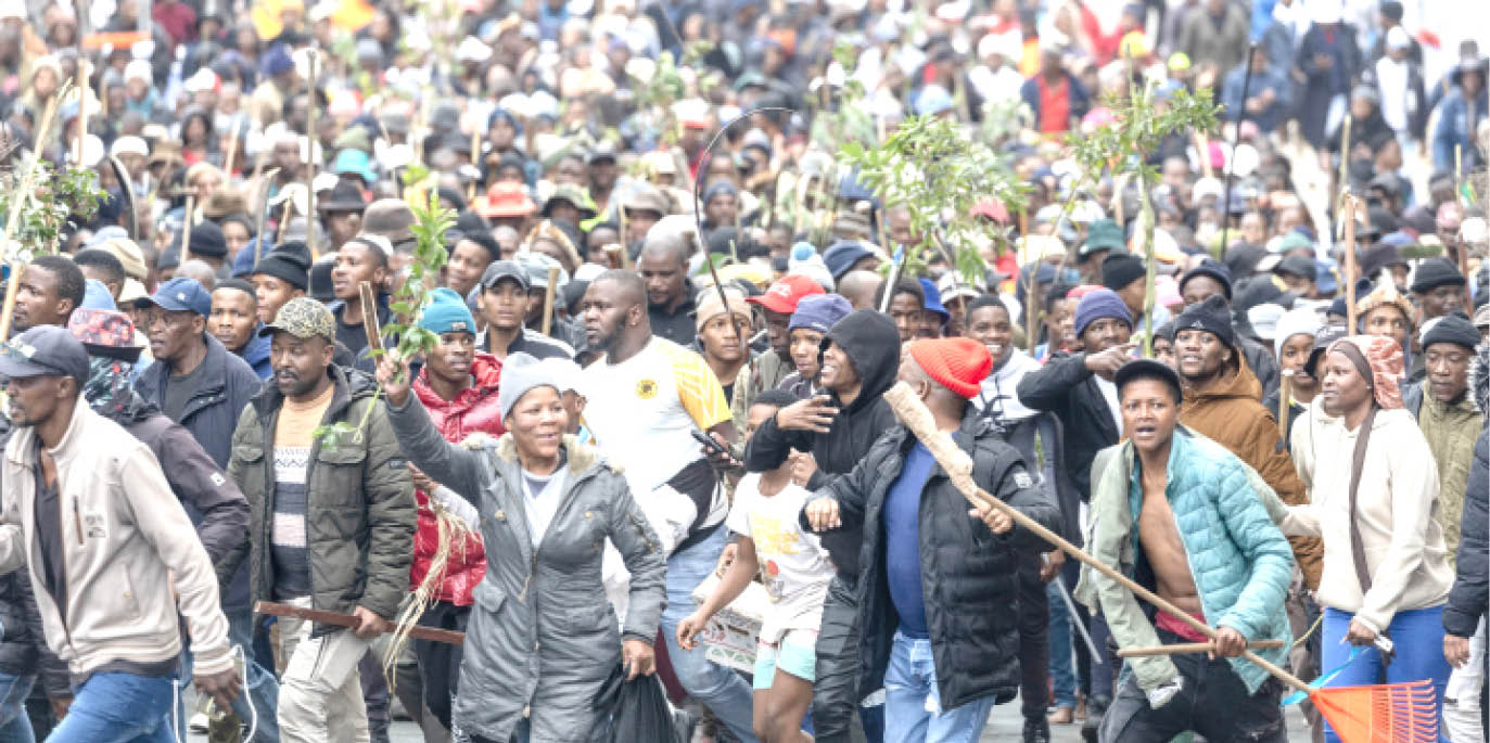 Protesters walk in street during a protest march against undocumented migrants in Yeoville Johannesburg South Africa recently